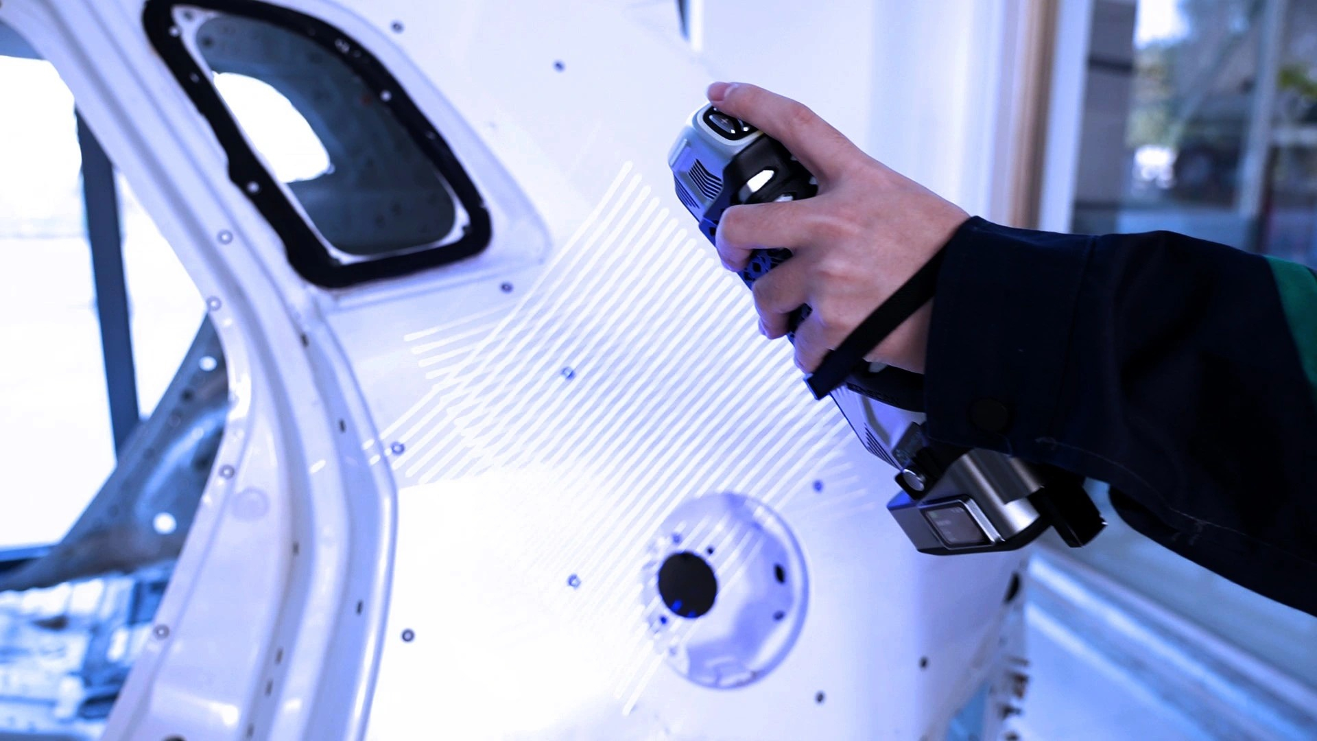 SIMSCAN E Gen2 handheld 3D scanner inspecting automotive body structures